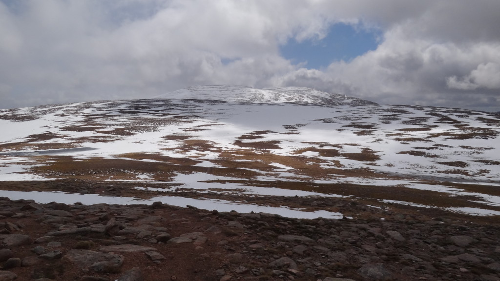 Mountain party covered in snow, with a path no longer visible