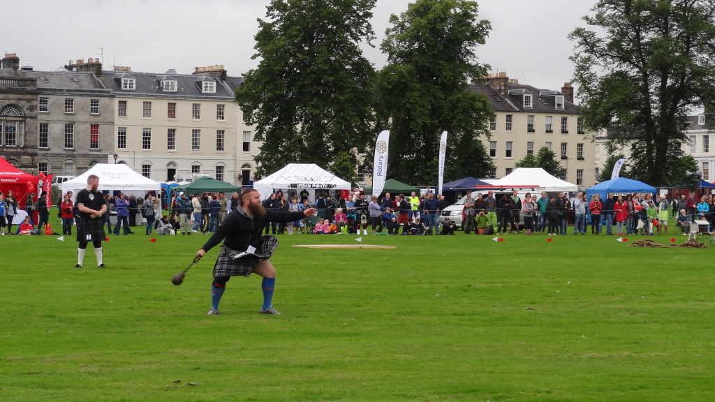 Perth Highland Games, man in kilt throwing something heavy