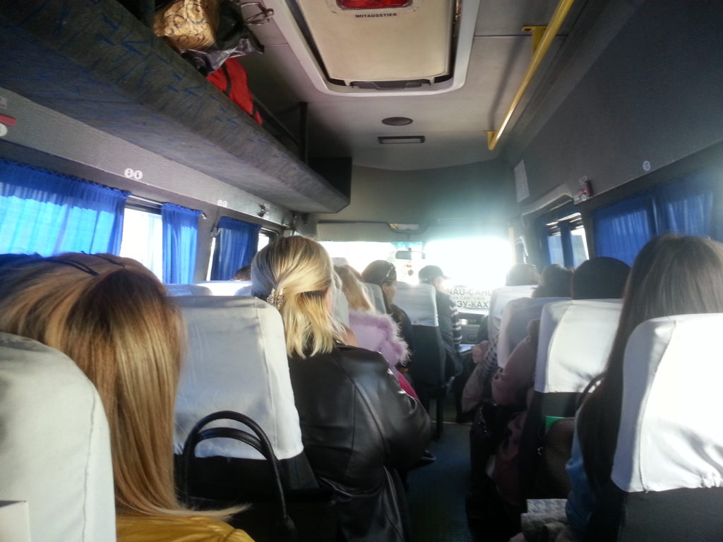 People sitting on a minibus