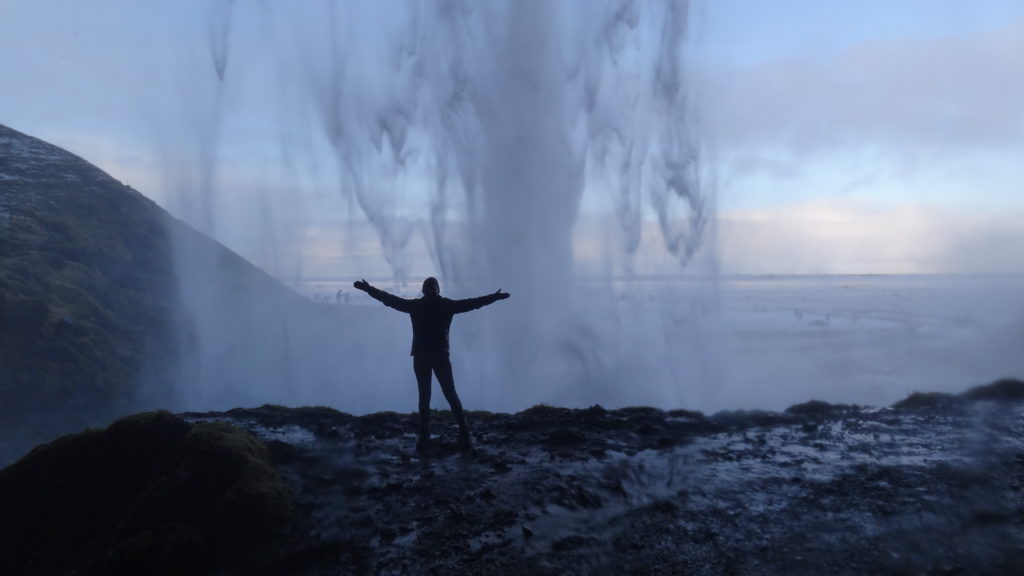 Getting soaked behind Seljalandsfoss waterfall